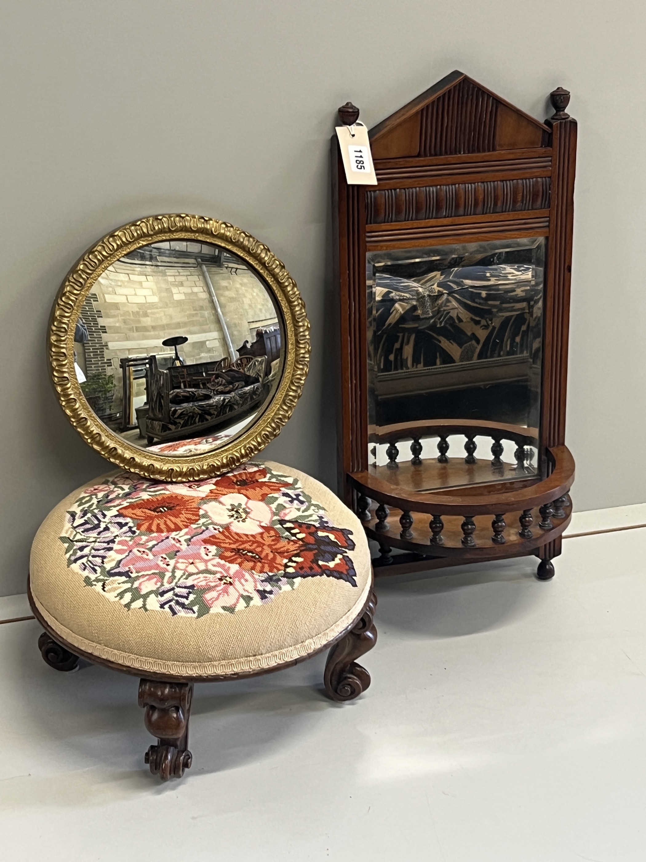 A late Victorian mahogany bowfront mirrored wall bracket, height 63cm, a Victorian circular footstool and a convex wall mirror